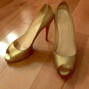 Christian louboutin gold peep toe pumps